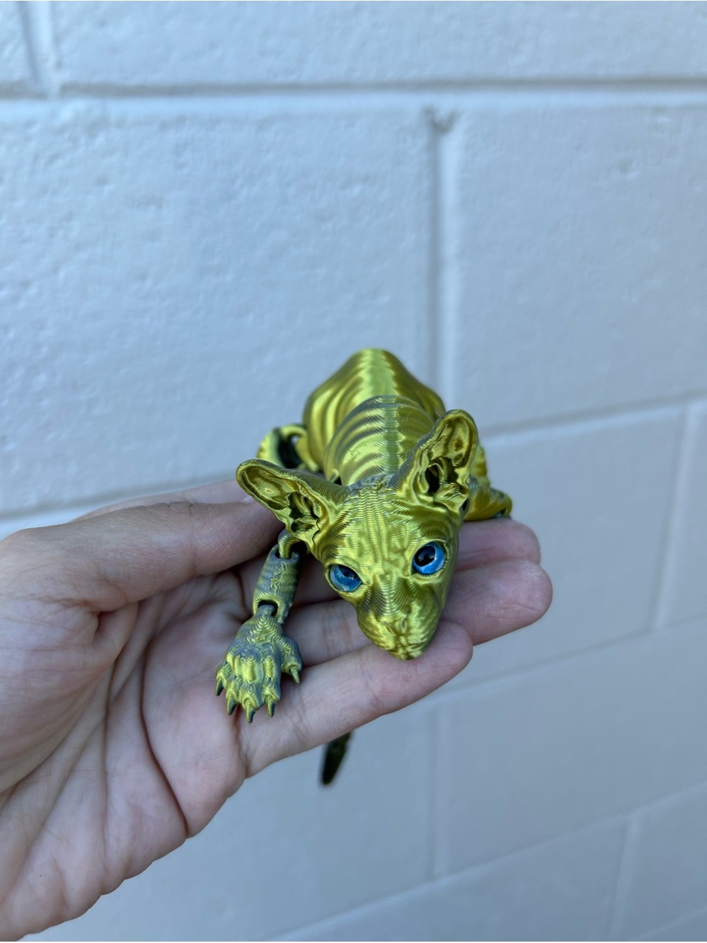 3D Printed Sphynx Cat Figurine Decor featuring a striking gold-and-green
